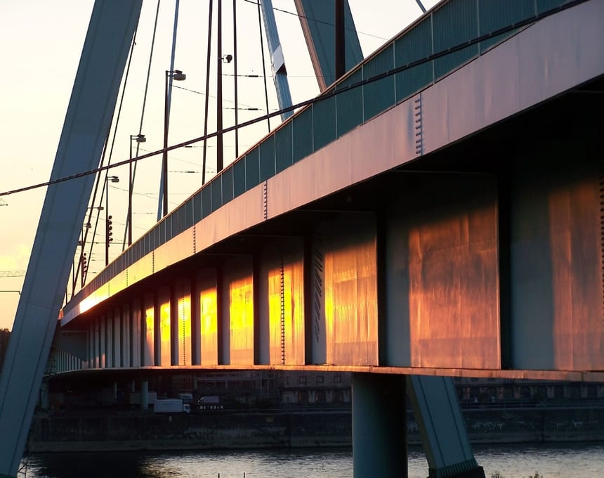 Steel bridge architecture with strong structural lines and spanning cables.